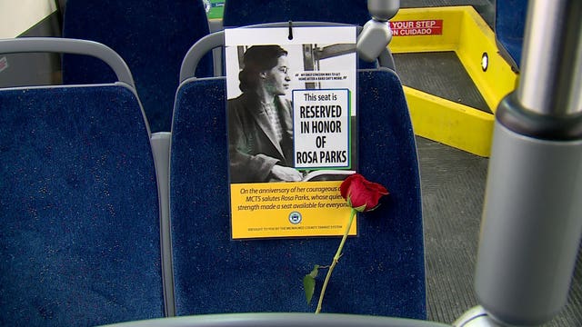 MCTS honoring Rosa Parks with open seat, red rose on every bus