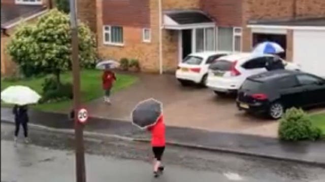 Neighbors start ‘singin’ in the rain’ with socially distanced dance party