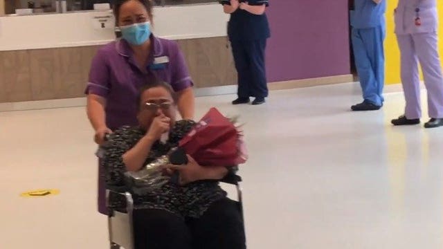 Nurse who was in coma for 40 days due to COVID-19 applauded by colleagues after hospital discharge