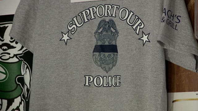 'Support our police:' Business owner raises money for memorial trip for officers' families
