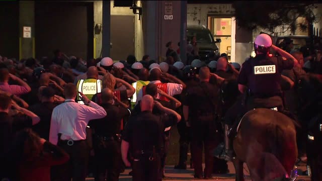 'Difficult time for us:' Emotional show of support as fallen officer arrives at medical examiner
