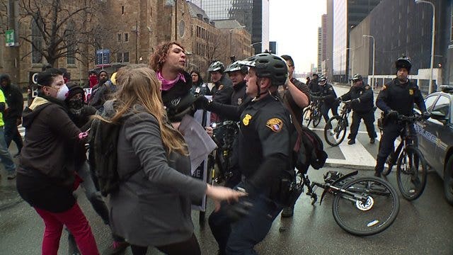 Video shows anti-Trump protester spitting in officer’s face