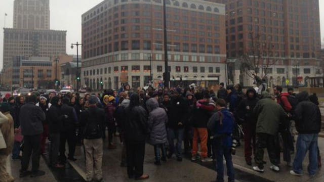 Dozens protest no-charging decision by walking streets in downtown Milwaukee