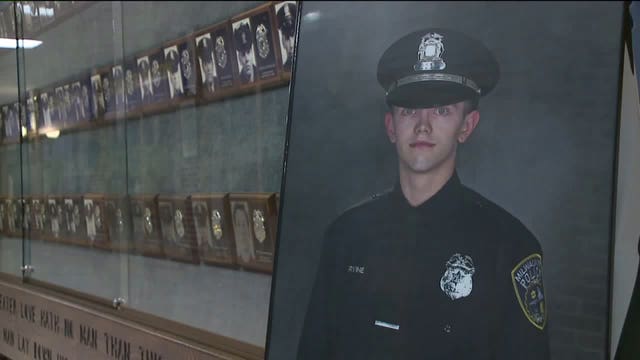 Photo of Officer Charles Irvine Jr. greets 58 MPD recruits at graduation ceremony