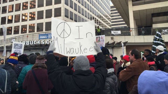 Hamilton family supporters gather at Red Arrow Park, march on city streets