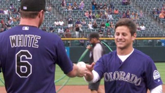 Wisconsin native, CO shooting survivor throws first pitch in Denver