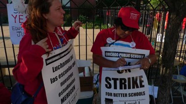 Chicago teachers rally as both sides consider deal
