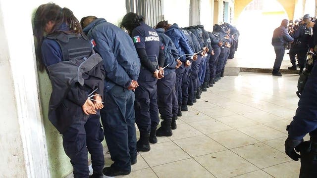 Entire police force of Mexico town detained after mayoral candidate's assassination