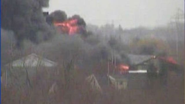 Neighbors hear "loud booms" from auto salvage fire; some evacuated