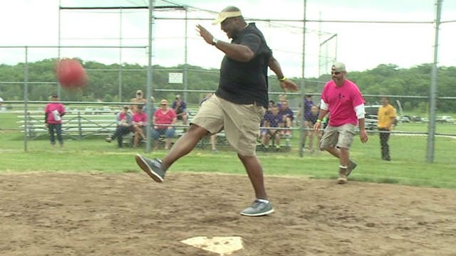 Former Packers DT Santana Dotson plays kickball in Wales for a good cause: "Celebrating kids in the community"