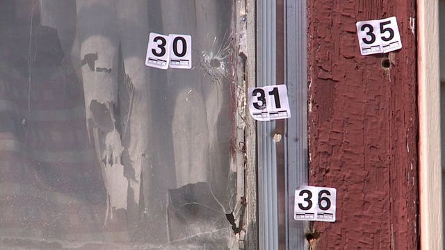 "Any of us could have got shot!" More than 40 bullets fired; several pierce home and one hit sleeping boy