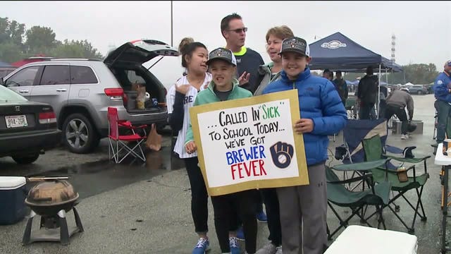 'We've got Brewer fever:' Fans tailgate at Miller Park despite rainy weather