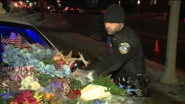 Growing memorial for Matthew Rittner outside MPD Specialized Patrol Division