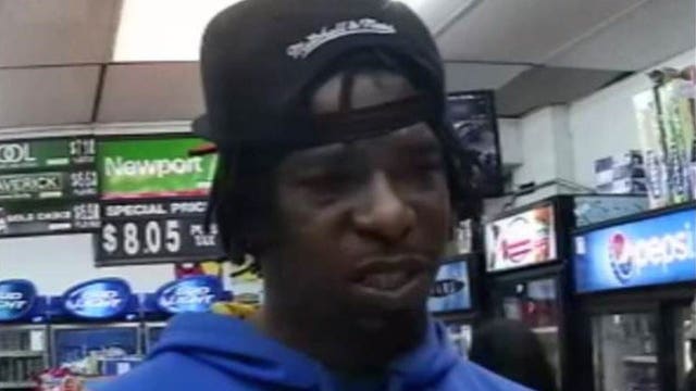 Recognize him? Police seek help to ID man who displayed gun during robbery at 35th and Galena