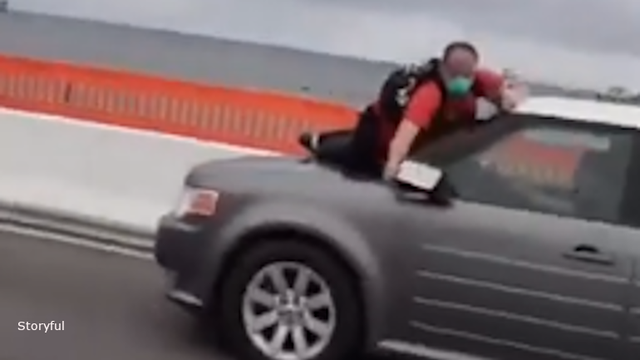 Man seen clinging to hood of moving car during Pensacola demonstrations