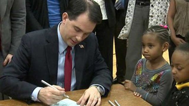 Walker signs Open Gym Act into law Thursday