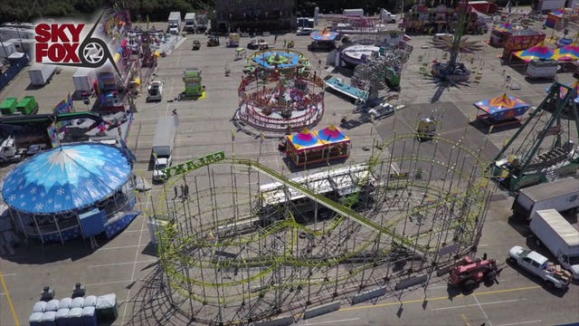 Workers prep and inspect rides at Wisconsin State Fair