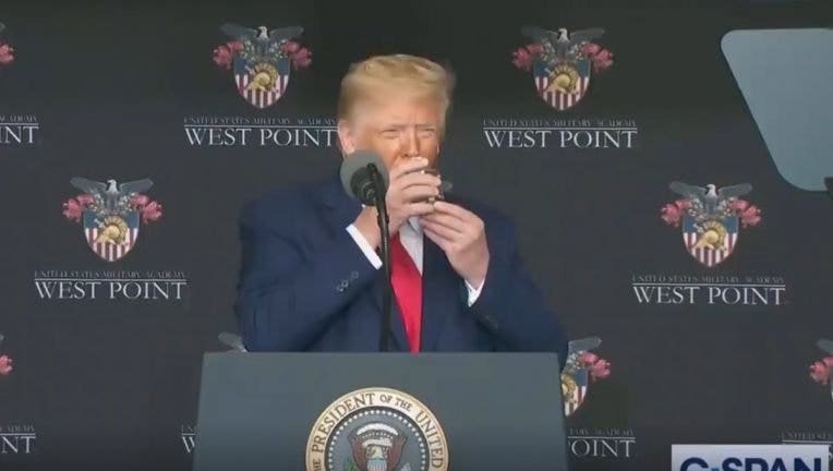 President Donald Trump used two hands to drink a glass of water during a speech at West Point on Saturday.
