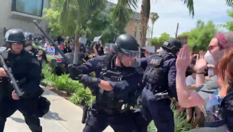 LAPD officers captured on video striking protesters with batons in Fairfax District