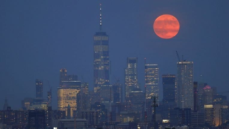 On the 50th anniversary of the launch of Apollo 11, the full buck moon rises above the skyline of lower Manhattan and One World Trade Center in New York City on July 16, 2019 as seen from Kearney, New Jersey. (Gary Hershorn/Getty Images / Getty Images)