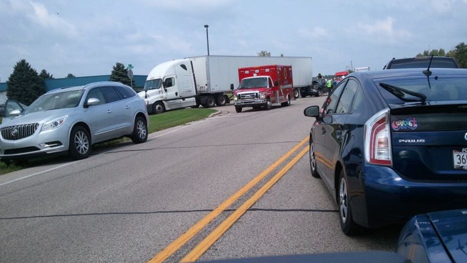 1 person hurt and cited in crash involving pickup truck, semi in Elkhorn
