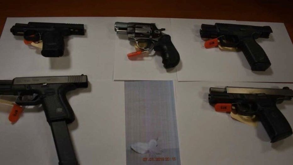 Police recover guns, drugs and cash as search warrant executed at Richards and Clarke