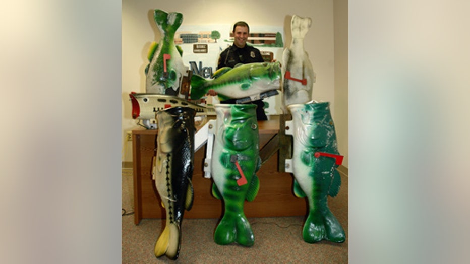 Officer Steve Thompson with the stolen fish mailboxes