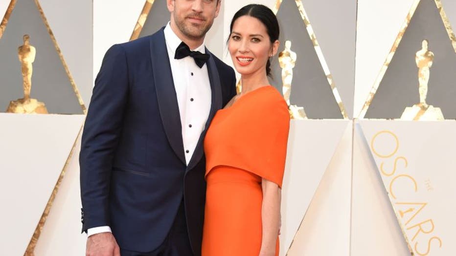 Actress Olivia Munn (R) and Aaron Rodgers arrives on the red carpet for the...