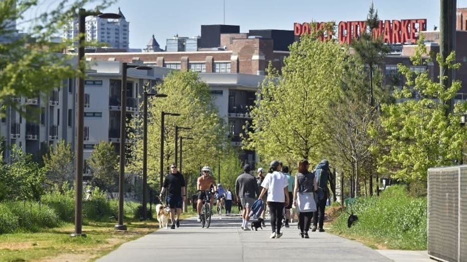 Various groups of people walking or biking along the Atlanta Beltline during social distancing (Credit: Austin McAfee/FOX 5 Atlanta).