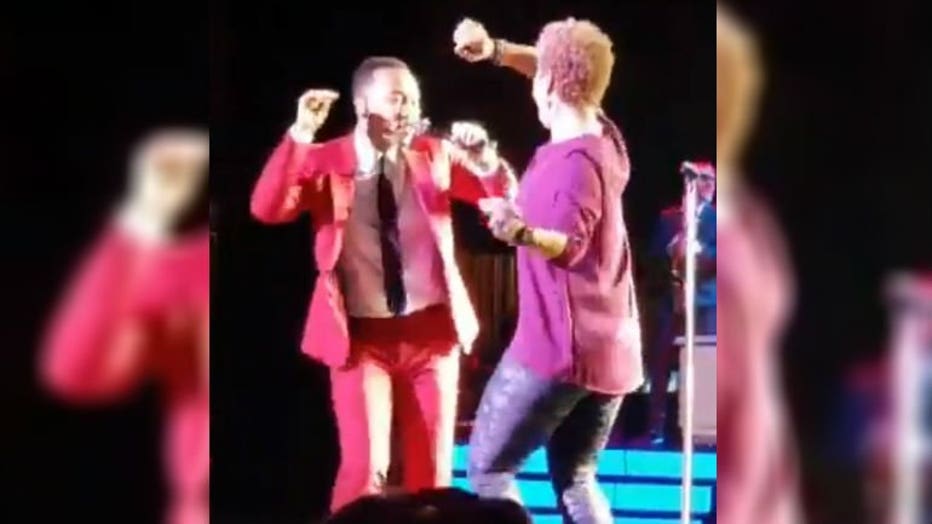 John Legend dances with woman courtesy: @_faith_alexis Twitter