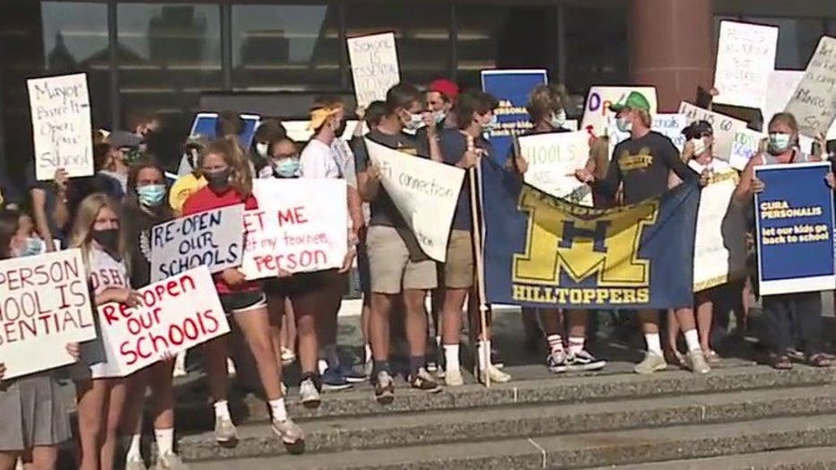 Protesters gather in downtown Milwaukee, demanding schools reopen this fall