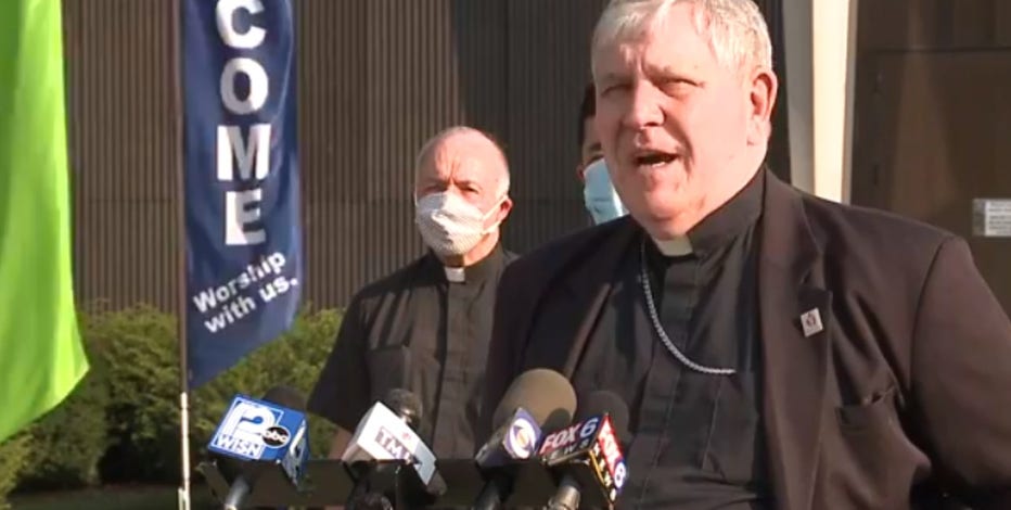 Catholic priests gather with Archbishop Listecki to pray for the people of Kenosha