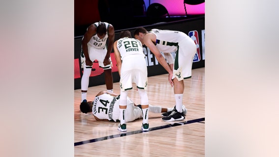 Game 4: Bucks beat Heat in OT; Giannis out with ankle injury