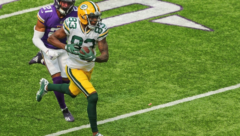 MINNEAPOLIS, MN - SEPTEMBER 13: Marquez Valdes-Scantling #83 of the Green Bay Packers runs after a pass reception in the third quarter against Mike Hughes #21 of the Minnesota Vikings at U.S. Bank Stadium on September 13, 2020 in Minneapolis, Minnesota. The Green Bay Packers defeated the Minnesota Vikings 43-34.(Photo by Adam Bettcher/Getty Images)