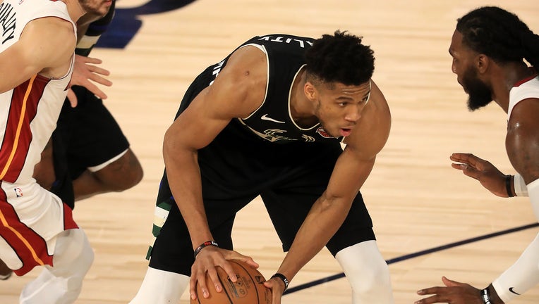LAKE BUENA VISTA, FLORIDA - SEPTEMBER 02: Giannis Antetokounmpo #34 of the Milwaukee Bucks drives the ball against the Miami Heat during the third quarter in Game Two of the Eastern Conference Second Round during the 2020 NBA Playoffs at the Field House at ESPN Wide World Of Sports Complex on September 02, 2020 in Lake Buena Vista, Florida. NOTE TO USER: User expressly acknowledges and agrees that, by downloading and or using this photograph, User is consenting to the terms and conditions of the Getty Images License Agreement. (Photo by Mike Ehrmann/Getty Images)