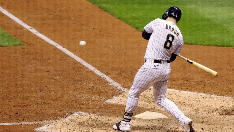 MILWAUKEE, WISCONSIN - SEPTEMBER 11: Ryan Braun #8 of the Milwaukee Brewers hits a sacrifice fly in the ninth inning to beat the Chicago Cubs 1-0 at Miller Park on September 11, 2020 in Milwaukee, Wisconsin. (Photo by Dylan Buell/Getty Images)