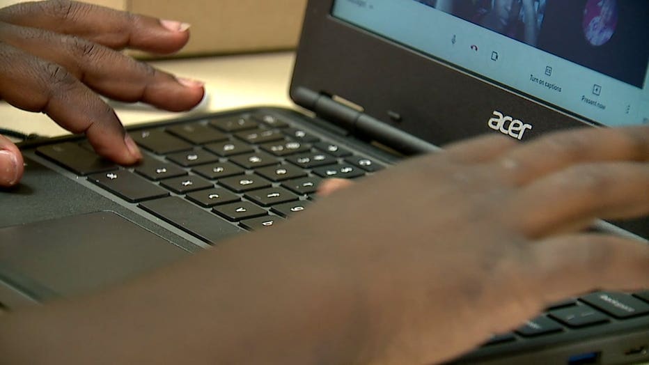 child using laptop for virtual learning, remote learning