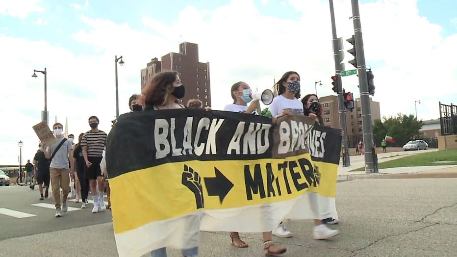 Students from Milwaukee High School of the Arts start a march, calling for law enforcement changes