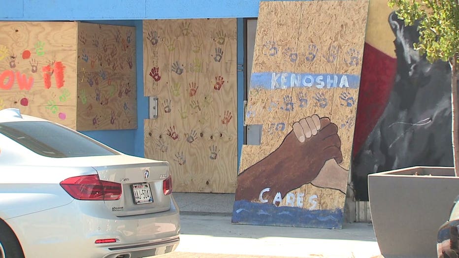 Messages painted on boarded Kenosha businesses