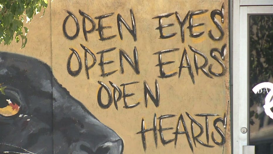 Messages painted on boarded Kenosha businesses