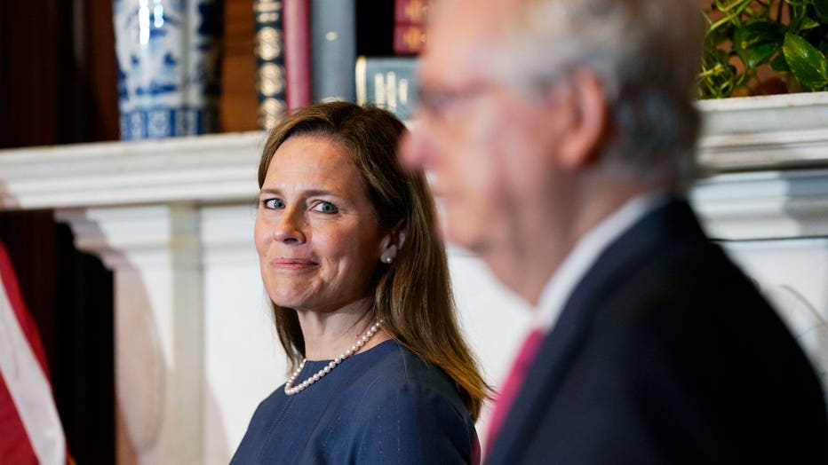 Seventh U.S. Circuit Court Judge Amy Coney Barrett (L), President Donald Trump's nominee for the U.S. Supreme Court, meets with Senate Majority Leader Mitch McConnell, R-K.Y., as she begins a series of meetings to prepare for her confirmation hearing, on Capitol Hill on Sept. 29, 2020 in Washington, D.C. (Photo by Susan Walsh-Pool/Getty Images)