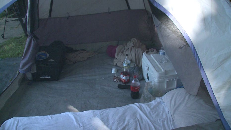 Michael Roman and Elsa Falero sleeping in Milwaukee backyard