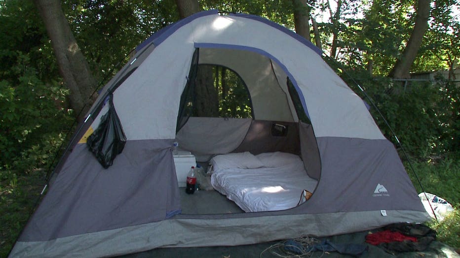 Michael Roman and Elsa Falero sleeping in Milwaukee backyard