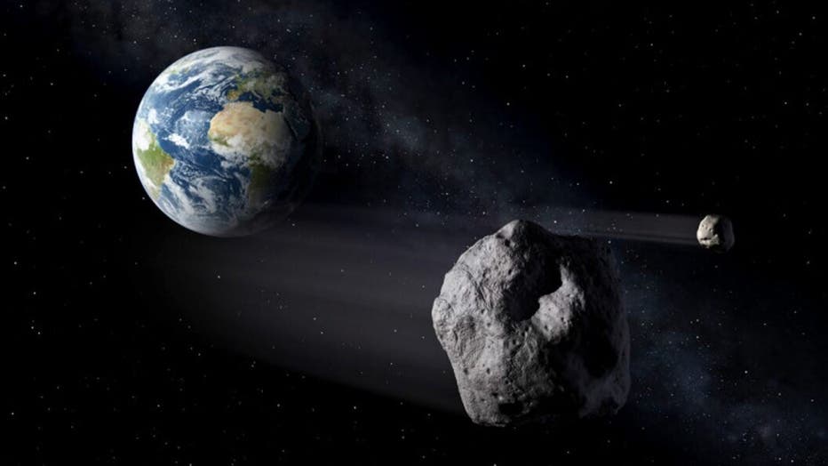 File photo: Artistic impression of two near-earth objects. (ESA / P. Carril)