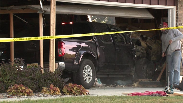 Pickup truck slams into house, driver sustains minor injuries