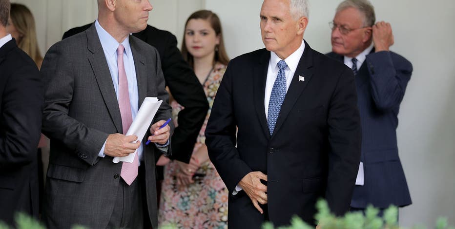 Pence to keep up travel despite contact with infected aides