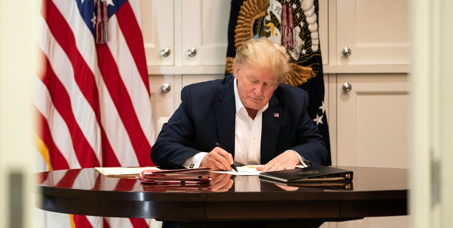 Doctor: Trump improving, but not 'out of the woods' yet