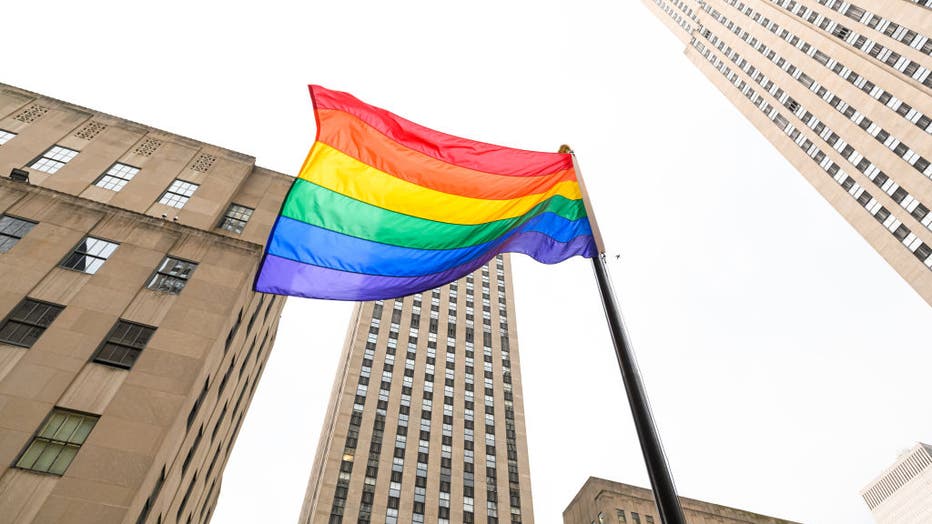 FILE - Rainbow flags are seen in Rockefeller Center in honor of the 50th anniversary of the first gay pride march on June 28, 2020 in New York City.