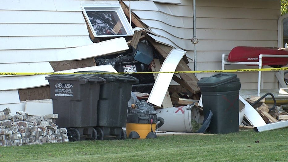 Pickup truck slams into house, driver sustains minor injuries