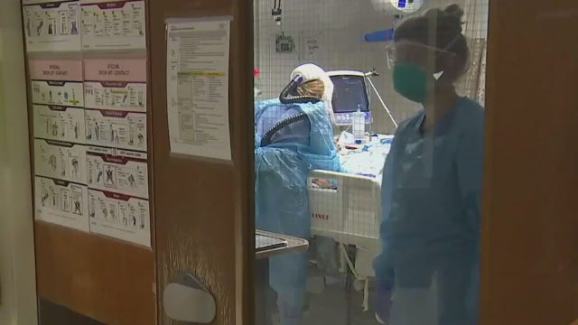 As hospitals near capacity, healthcare workers plead for compliance